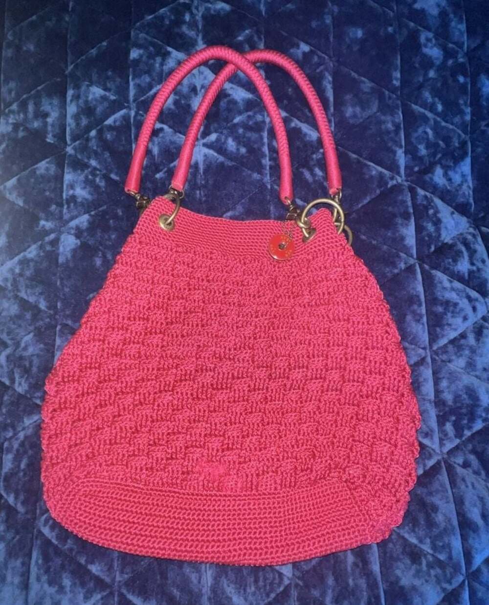 The Sak Hand-Crocheted Fuchsia Pink Shoulder Bag with Brass Hardware